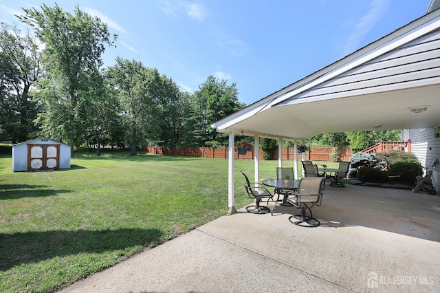 505 Runyon Ave, Piscataway, NJ 08854 - view of yard featuring a patio, a storage shed, outdoor dining space, and a carport