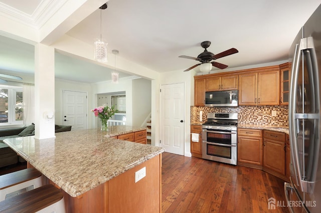 505 Runyon Ave, Piscataway, NJ 08854 - kitchen with appliances with stainless steel finishes, a ceiling fan, brown cabinetry, tasteful backsplash, and ornamental molding