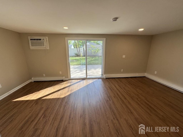 43 Overbrook Dr, Colonia, NJ 07067 - spare room featuring a baseboard heating unit, baseboards, dark wood-style floors, recessed lighting, and a smoke detector