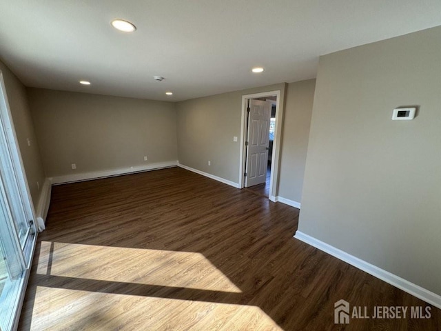 43 Overbrook Dr, Colonia, NJ 07067 - empty room featuring dark wood finished floors, baseboards, and recessed lighting