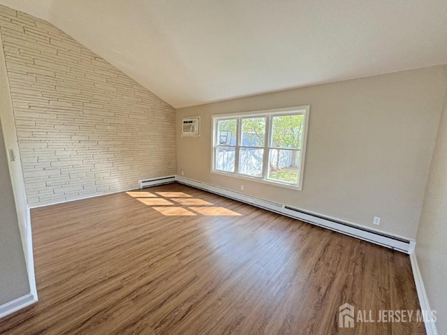 43 Overbrook Dr, Colonia, NJ 07067 - empty room featuring wood finished floors, a baseboard radiator, baseboard heating, lofted ceiling, and a wall unit AC