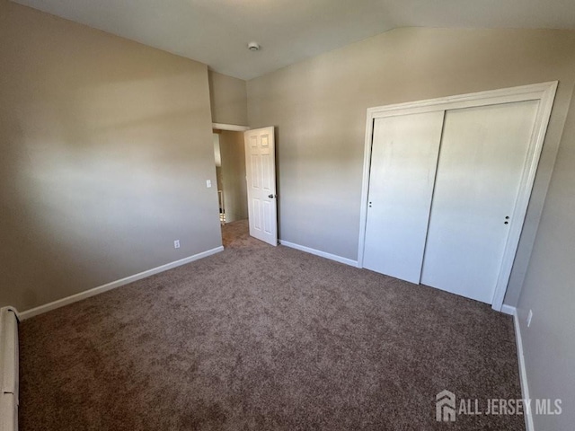 43 Overbrook Dr, Colonia, NJ 07067 - unfurnished bedroom with vaulted ceiling, baseboards, carpet, and a closet