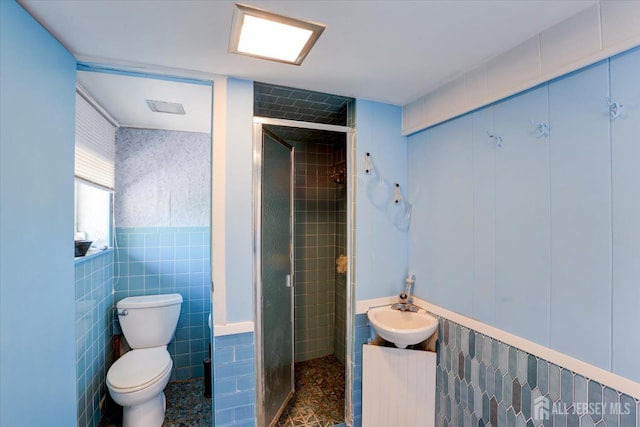 403 New Dover Rd, Colonia, NJ 07067 - bathroom featuring tile walls, a stall shower, vanity, and tile patterned floors