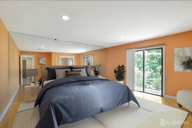 403 New Dover Rd, Colonia, NJ 07067 - bedroom with light wood-style flooring, access to exterior, and recessed lighting
