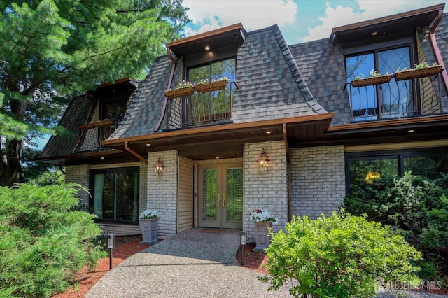 403 New Dover Rd, Colonia, NJ 07067 - doorway to property with a balcony, french doors, brick siding, and a shingled roof