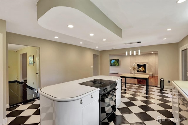 403 New Dover Rd, Colonia, NJ 07067 - kitchen with range with electric cooktop, dark flooring, recessed lighting, a kitchen island, and light countertops
