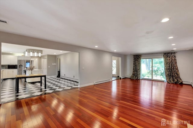 403 New Dover Rd, Colonia, NJ 07067 - unfurnished living room with wood finished floors, recessed lighting, baseboard heating, a baseboard heating unit, and a chandelier