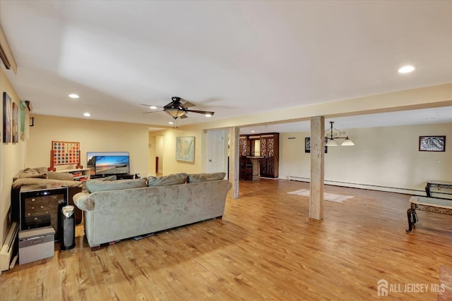 403 New Dover Rd, Colonia, NJ 07067 - living area featuring light wood-style floors, ceiling fan, recessed lighting, and a baseboard radiator