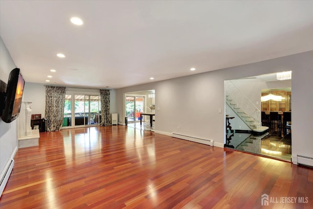 403 New Dover Rd, Colonia, NJ 07067 - unfurnished living room with wood finished floors, stairway, recessed lighting, and a baseboard radiator