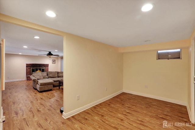 403 New Dover Rd, Colonia, NJ 07067 - unfurnished living room with wood finished floors, a brick fireplace, recessed lighting, and a ceiling fan