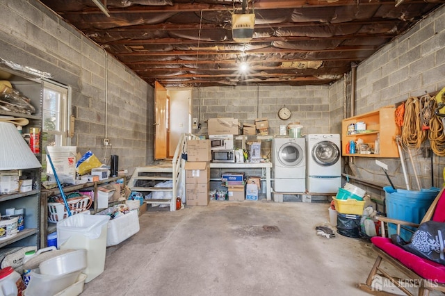 below grade area with washing machine and clothes dryer