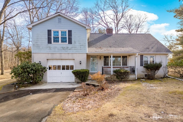 view of front of home featuring a garage and a porch