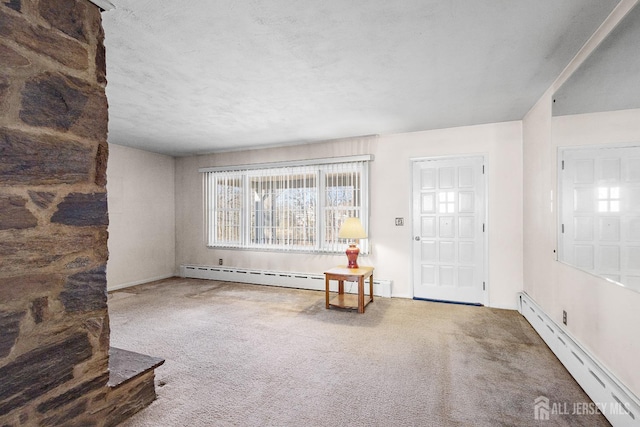 entryway with carpet floors and a baseboard radiator