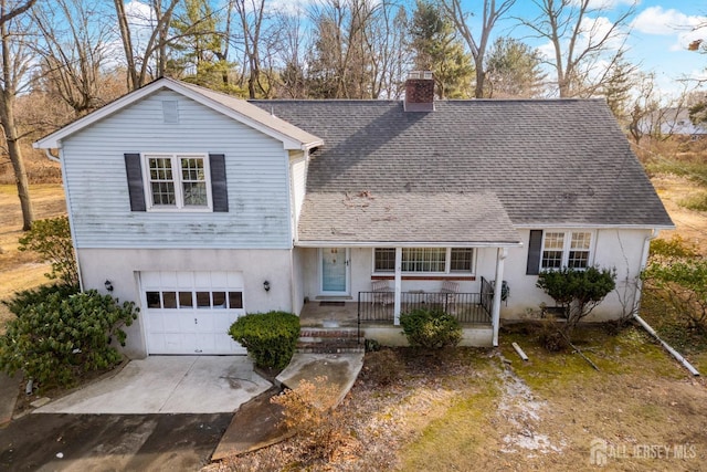 view of front of home featuring a garage and covered porch