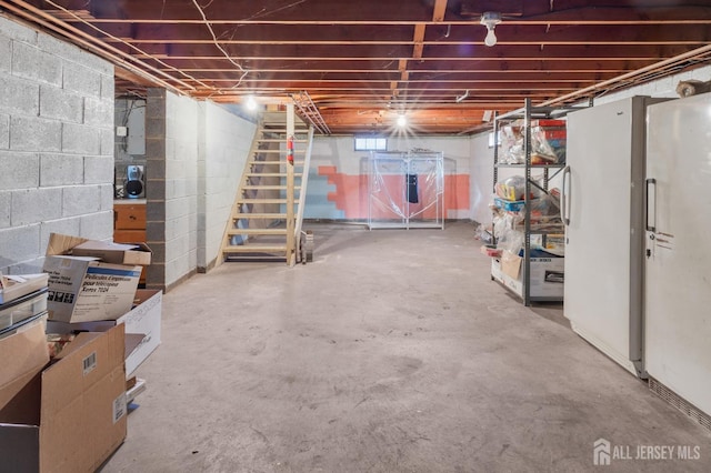 unfinished basement featuring electric panel