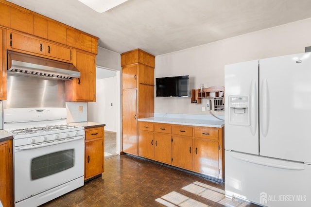 kitchen featuring range hood, light countertops, backsplash, brown cabinetry, and white appliances