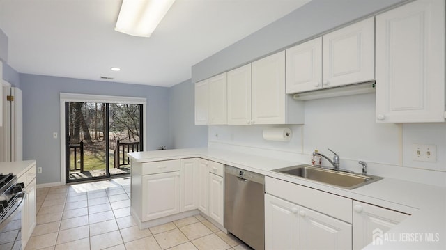 kitchen featuring a peninsula, white cabinets, light countertops, and dishwasher