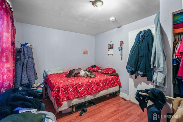 188 Seaman St, New Brunswick, NJ 08901 - bedroom featuring wood finished floors