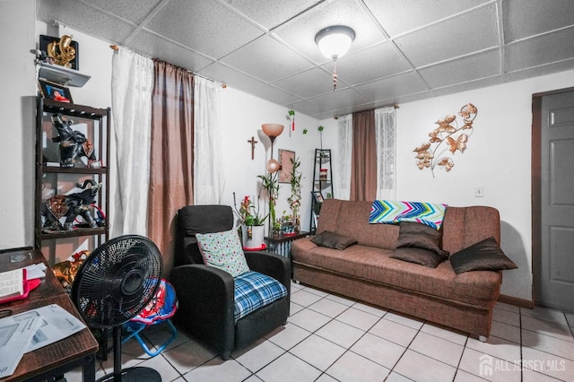 188 Seaman St, New Brunswick, NJ 08901 - living area with a drop ceiling, light tile patterned floors, and baseboards