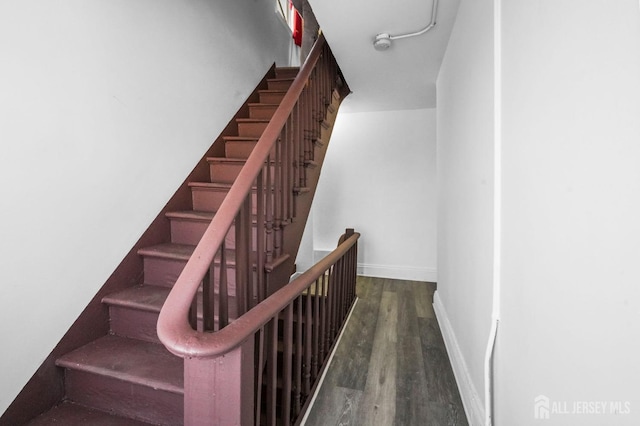 188 Seaman St, New Brunswick, NJ 08901 - staircase with wood finished floors and baseboards