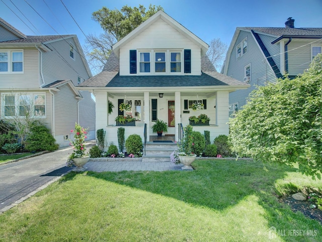 939 Salem Rd, Union Twp, NJ 07083 - bungalow-style home with covered porch, roof with shingles, and a front lawn