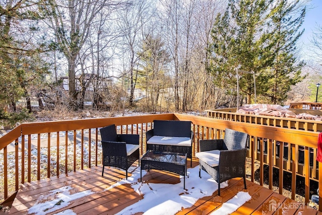 view of snow covered deck