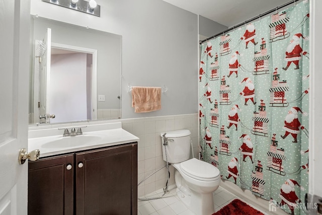 bathroom featuring vanity, tile walls, tile patterned floors, and toilet