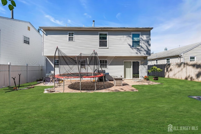 30 Montague Ave, Woodbridge Proper, NJ 08830 - back of property featuring a trampoline and a fenced backyard