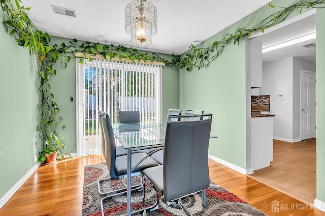 30 Montague Ave, Woodbridge Proper, NJ 08830 - dining space featuring wood finished floors and a chandelier