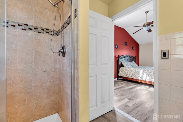 30 Montague Ave, Woodbridge Proper, NJ 08830 - ensuite bathroom featuring ceiling fan, wood finished floors, a tile shower, and vaulted ceiling