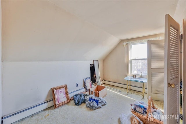 bonus room with a baseboard heating unit, baseboard heating, and lofted ceiling