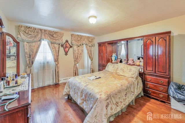 bedroom with light wood-style flooring