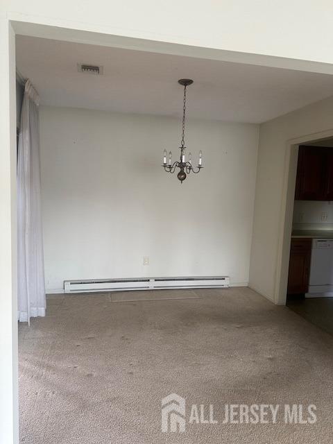 unfurnished dining area with visible vents, a baseboard radiator, an inviting chandelier, and carpet floors