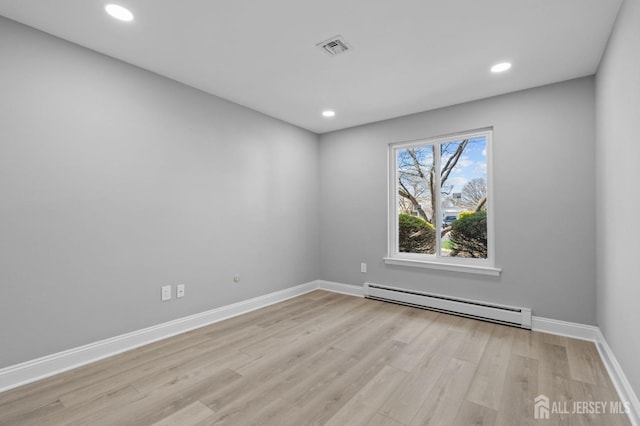 91 Dogwood Plz Unit A, Monroe, NJ 08831 - unfurnished room featuring baseboard heating, light wood finished floors, baseboards, and recessed lighting