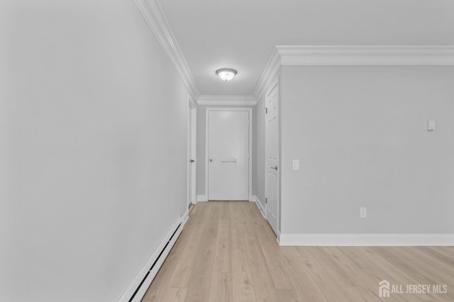 91 Dogwood Plz Unit A, Monroe, NJ 08831 - hallway with light wood-style flooring, crown molding, baseboards, and a baseboard heating unit