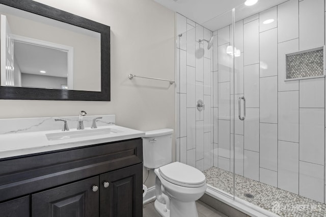 91 Dogwood Plz Unit A, Monroe, NJ 08831 - full bathroom featuring toilet, vanity, a shower stall, baseboards, and recessed lighting