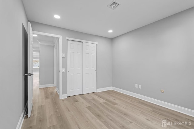 91 Dogwood Plz Unit A, Monroe, NJ 08831 - unfurnished bedroom with light wood-type flooring, baseboards, a closet, and recessed lighting