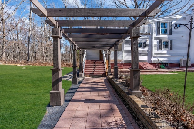 view of community featuring a lawn and a pergola