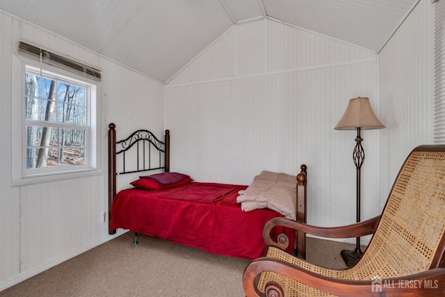 carpeted bedroom featuring vaulted ceiling