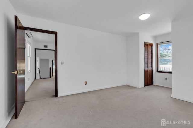 unfurnished bedroom featuring baseboards and carpet