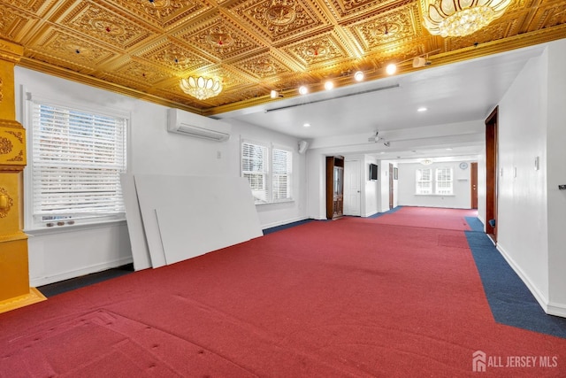 interior space with an ornate ceiling, a wall mounted AC, and baseboards