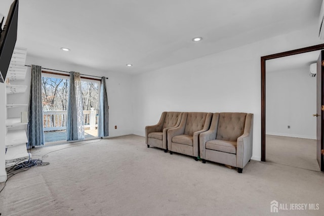 living area with carpet flooring, recessed lighting, and baseboards