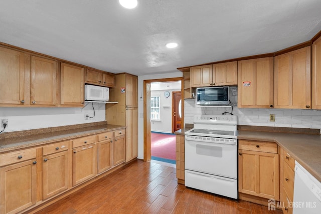 kitchen featuring white appliances, wood finished floors, open shelves, recessed lighting, and tasteful backsplash