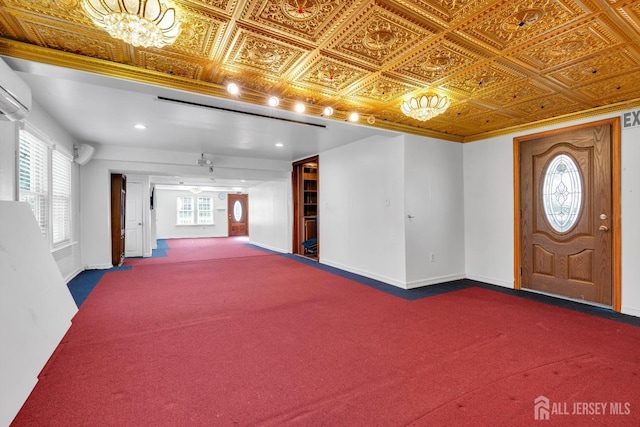 interior space featuring dark colored carpet, baseboards, and an ornate ceiling