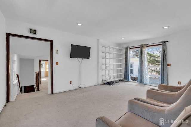 sitting room featuring recessed lighting, an upstairs landing, and carpet flooring