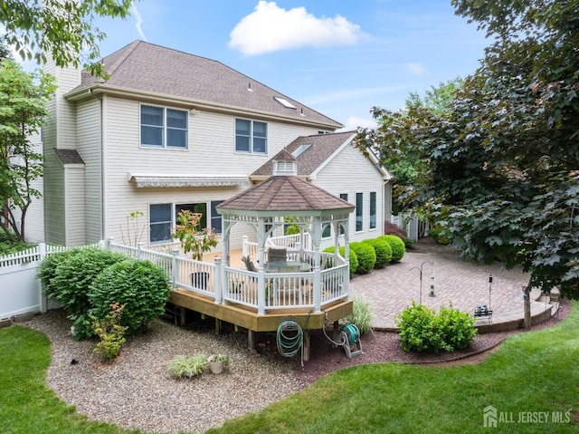 18 Stout Dr, Hillsborough, NJ 08844 - rear view of house featuring a gazebo, a deck, a chimney, and a shingled roof