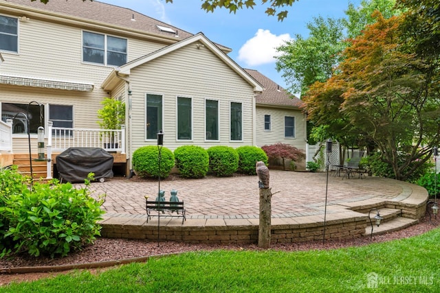18 Stout Dr, Hillsborough, NJ 08844 - rear view of house with a patio area and a wooden deck