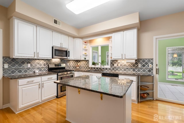18 Stout Dr, Hillsborough, NJ 08844 - kitchen with stainless steel appliances, light wood finished floors, and white cabinets