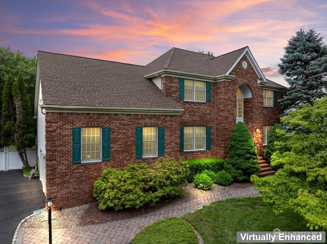 18 Stout Dr, Hillsborough, NJ 08844 - colonial house with a shingled roof, brick siding, and driveway