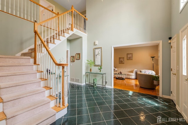 18 Stout Dr, Hillsborough, NJ 08844 - foyer entrance featuring a high ceiling, stairs, and tile patterned floors